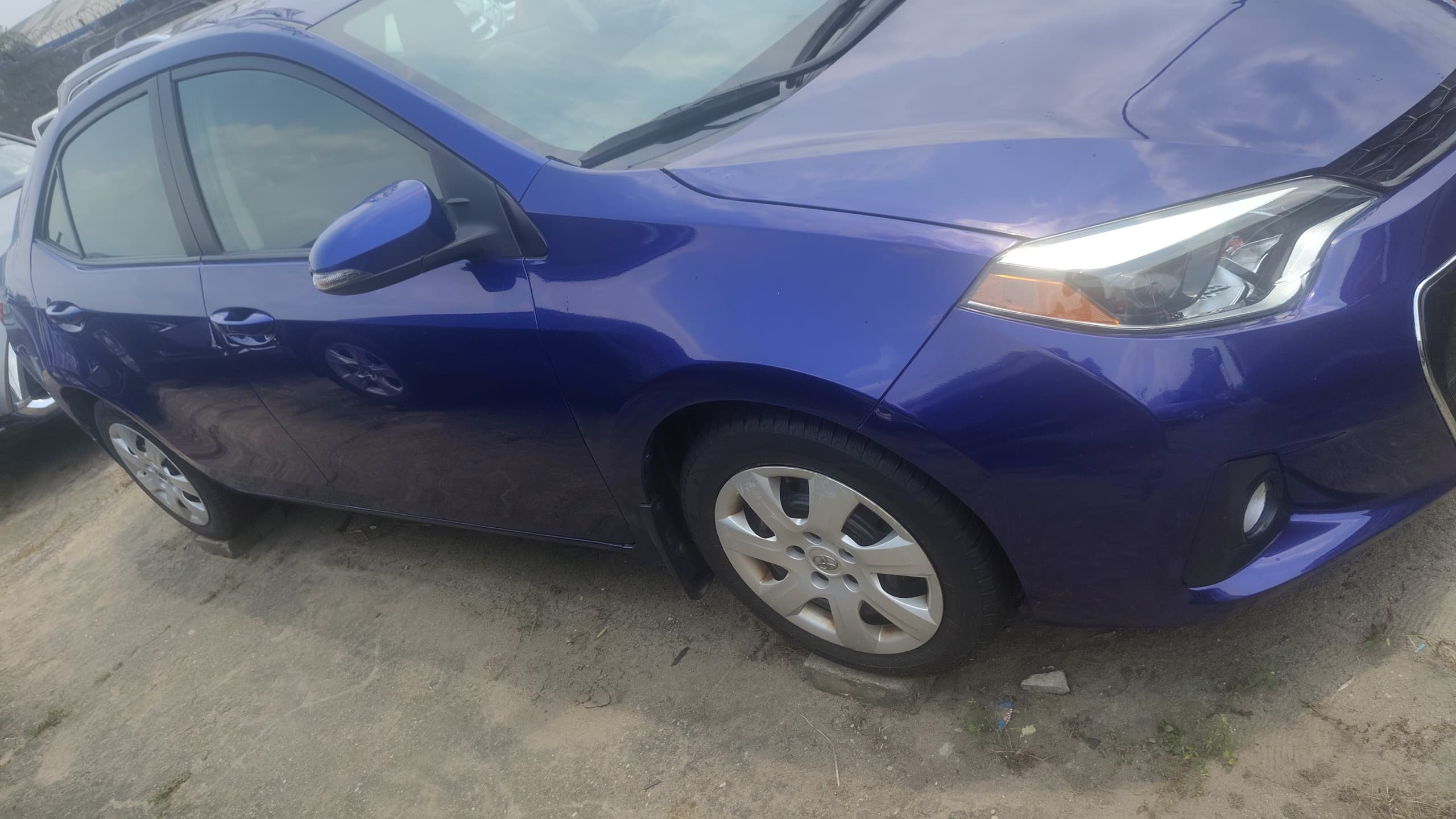 Toyota Corolla in vibrant blue — front-quarter view, available at Sabfatex Autos, Port Harcourt
